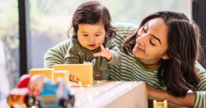 a mother practicing toddler parenting at home